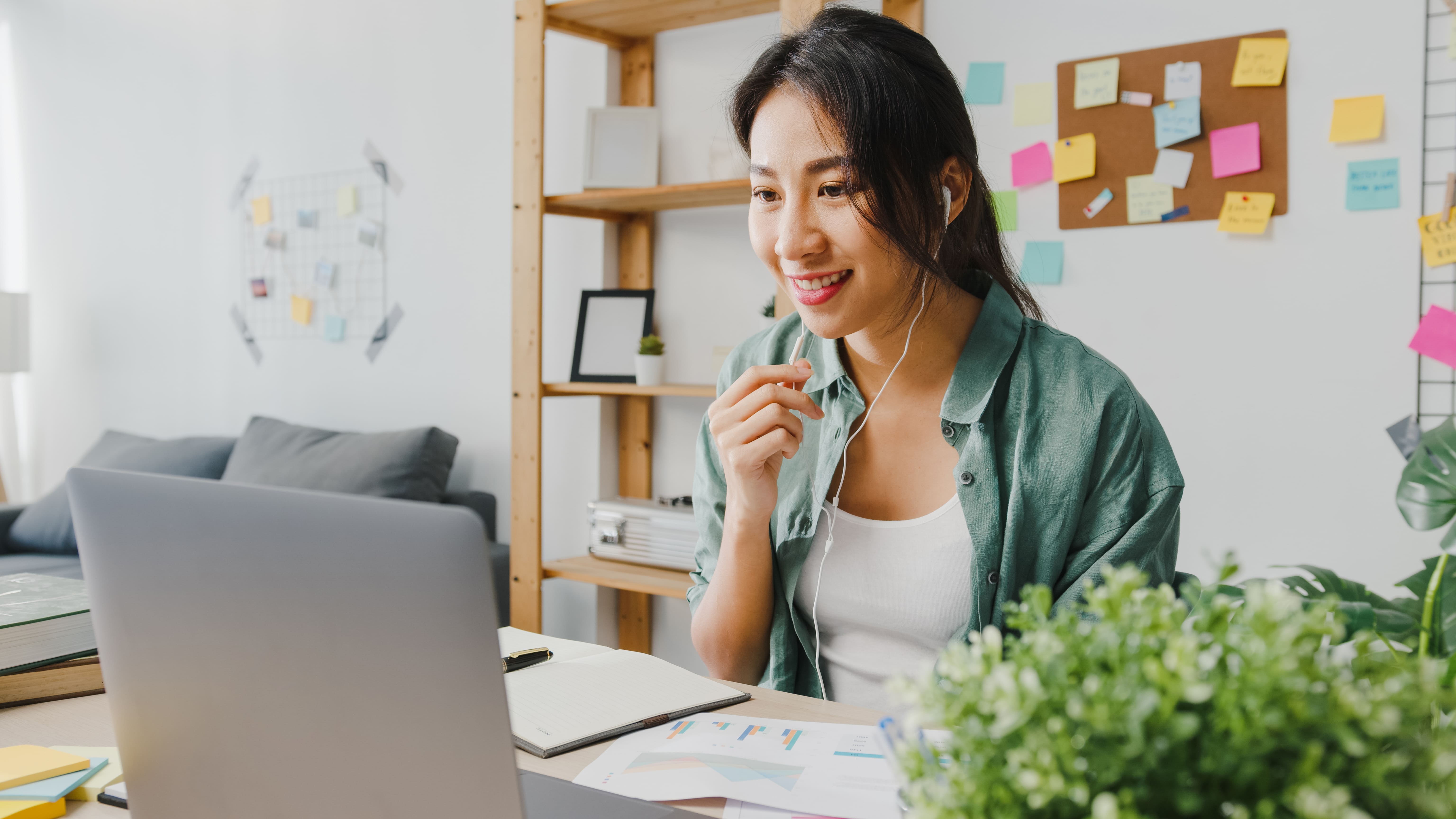 asia-businesswoman-using-laptop-talk-colleagues-about-plan-video-call-while-smart-working-from-home-living-room (1)